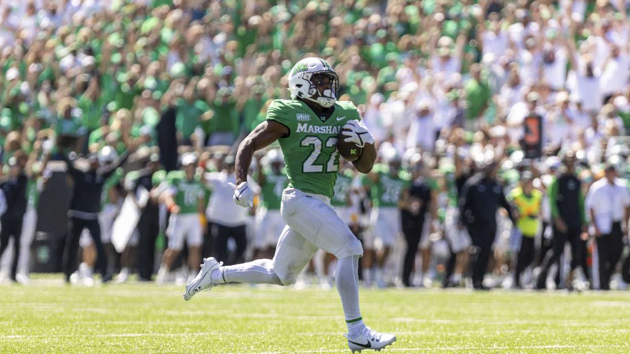 Marshall running back Rasheen Ali (22) breaks free for a score as the Herd takes on Virginia Tech during an NCAA college football game, Saturday, Sept. 23, 2023, at Joan C. Edwards Stadium in Huntington, W.Va.