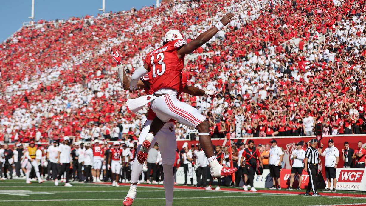 Utah Utes quarterback Nate Johnson (13) celebrates the touchdown with Utah Utes receiver Landen King(82) in Salt Lake City on Saturday, Sept. 23, 2023.