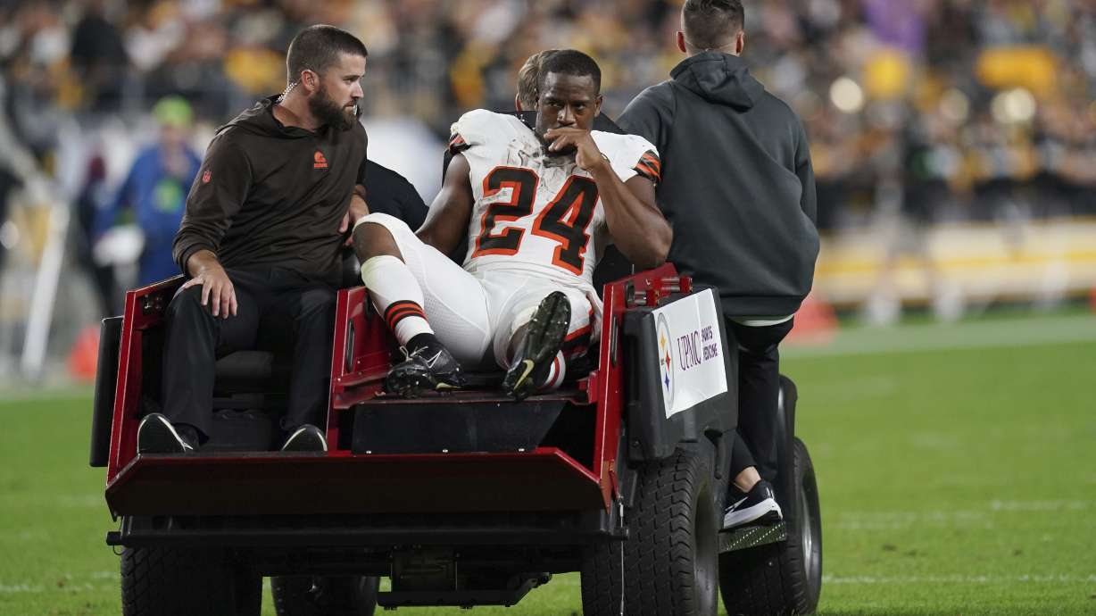 Cleveland Browns running back Nick Chubb is cared off the field with an injury during the first half of an NFL football game against the Pittsburgh Steelers Monday, Sept. 18, 2023, in Pittsburgh.
