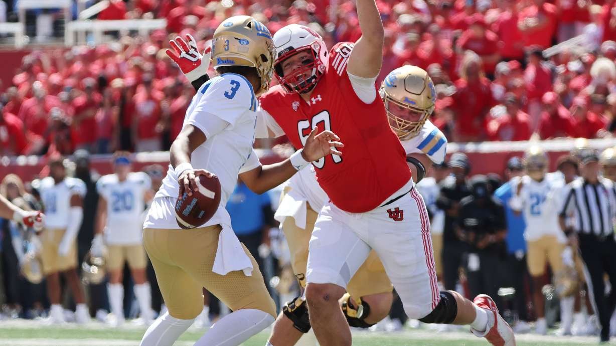 Utah Utes defensive tackle Keanu Tanuvasa (57) eventually sacks UCLA Bruins quarterback Dante Moore (3) in Salt Lake City on Saturday, Sept. 23, 2023.