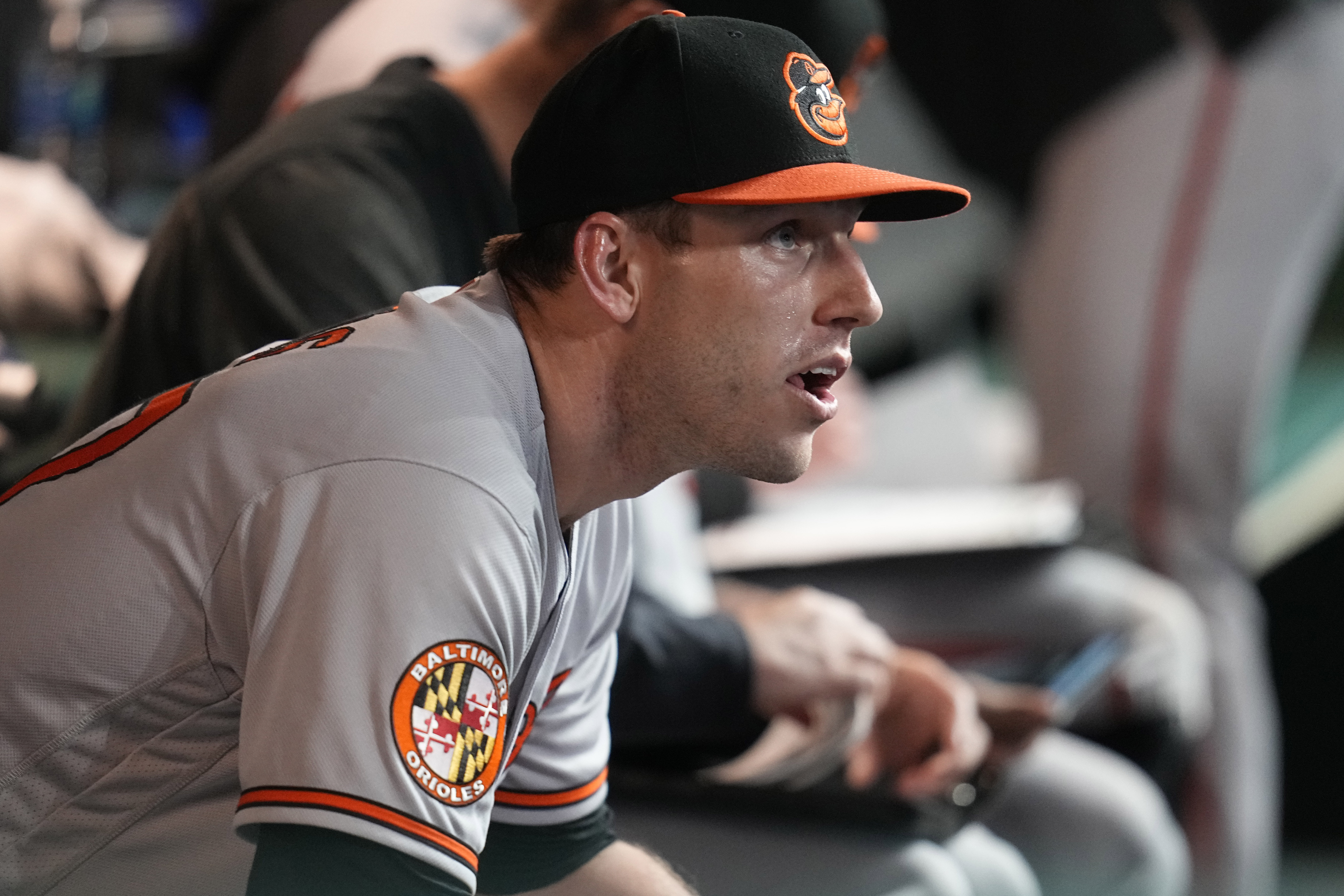 Baltimore Orioles starting pitcher John Means sits in the dugout after being taken out of the game in the eighth inning of a baseball game against the Cleveland Guardians, Saturday, Sept. 23, 2023, in Cleveland.