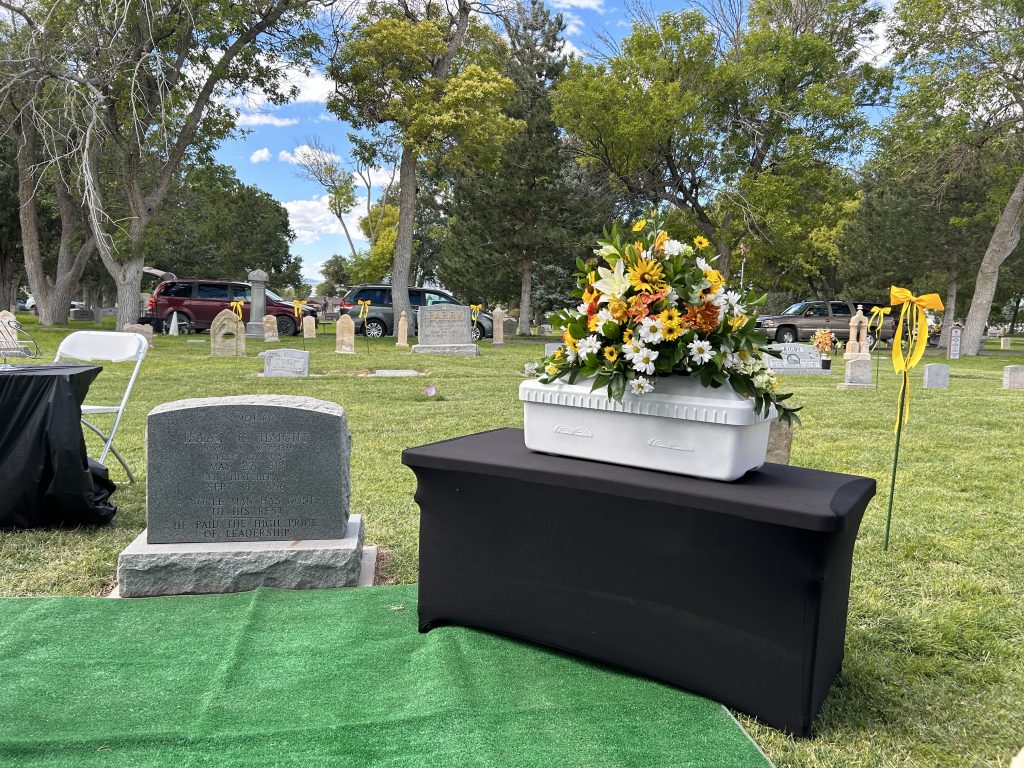 The remains of pioneer Isaac C. Haight were housed in a small white casket adorned with yellow flowers, Cedar City, Utah, Sept. 16. Haight, noted Mormon pioneer and Cedar City’s first mayor, was reburied on Saturday in his former hometown alongside three of his five wives, just over 137 years after his death.