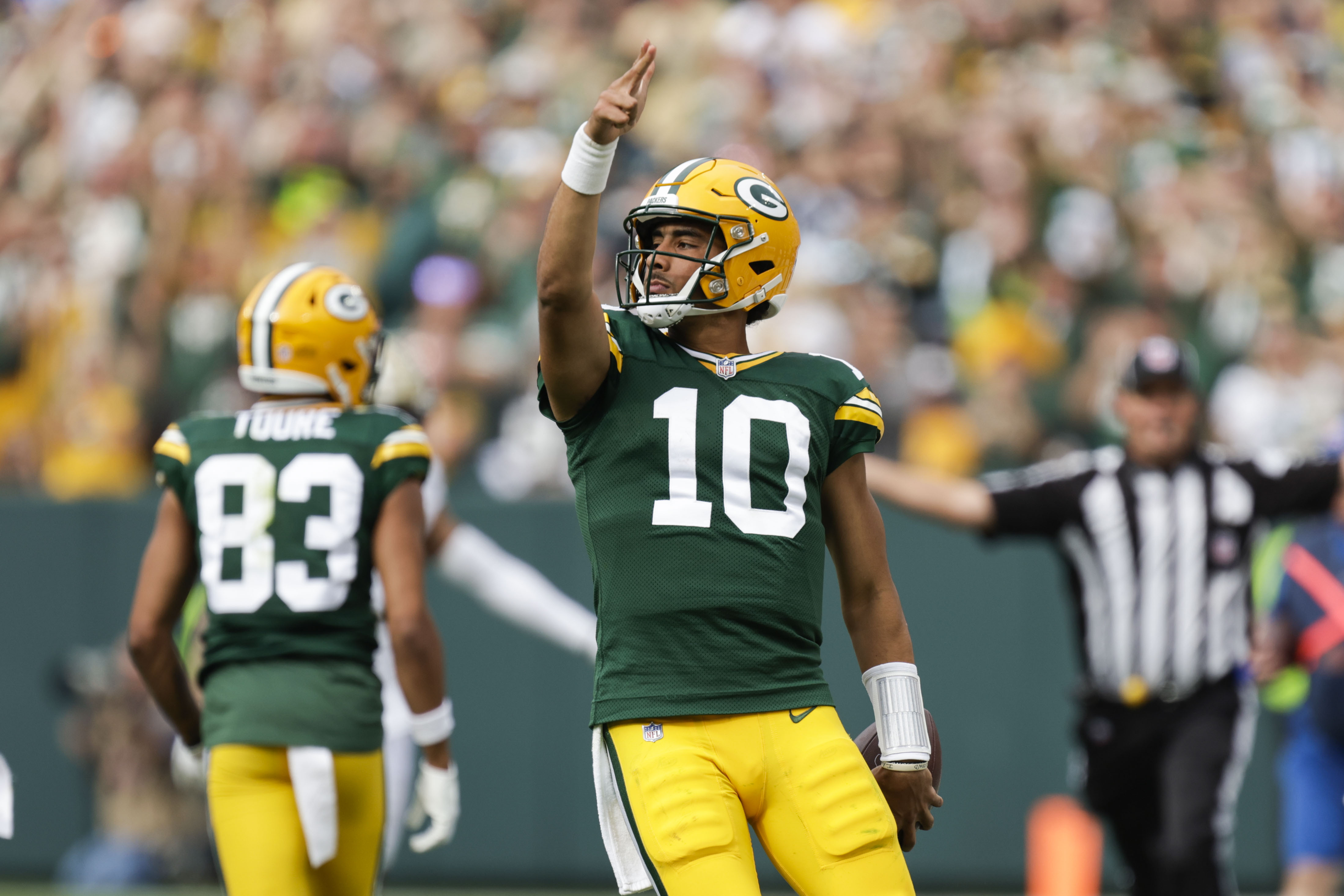 Green Bay Packers quarterback Jordan Love (10) reacts after carrying for a first down during the second half of an NFL football game against the New Orleans Saints Sunday, Sept. 24, 2023, in Green Bay, Wis.