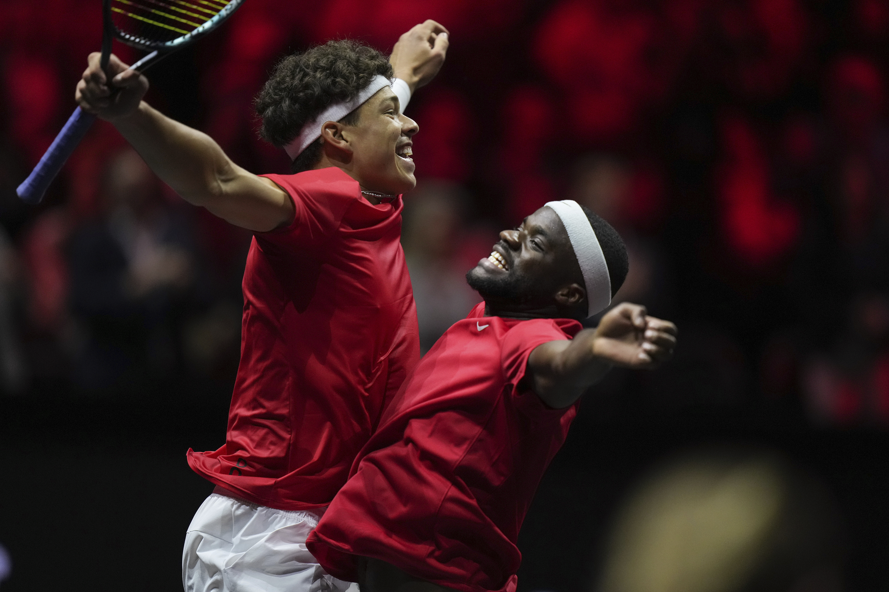 Team World's Ben Shelton, left, and Frances Tiafoe bump chests after defeating Team Europe's Hubert Hurkacz and Andrey Rublev during a Laver Cup tennis doubles match in Vancouver, British Columbia, Sunday, Sept. 24, 2023.
