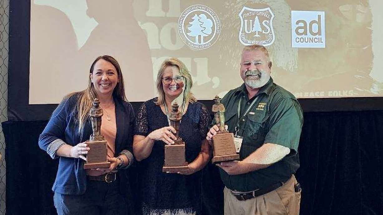 Kayli Guild of the Utah Division of Forestry, Fire and State Lands, far left, accepts bronze level of the Smokey Bear Award by the National Association of State Foresters during its conference in Baton Rouge, Louisiana on Wednesday.