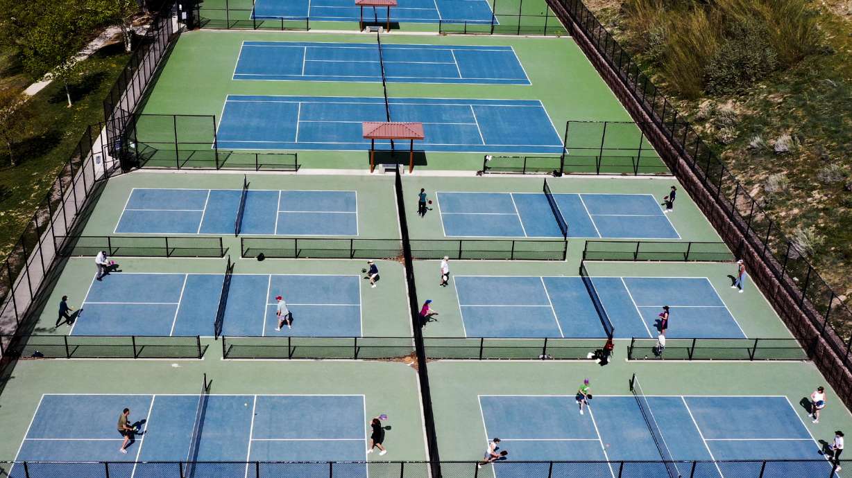 Tennis courts sit vacant at 11th Avenue Park in Salt Lake City on May 12. New products may solve complaints tied to the pickleball as it soars in popularity.