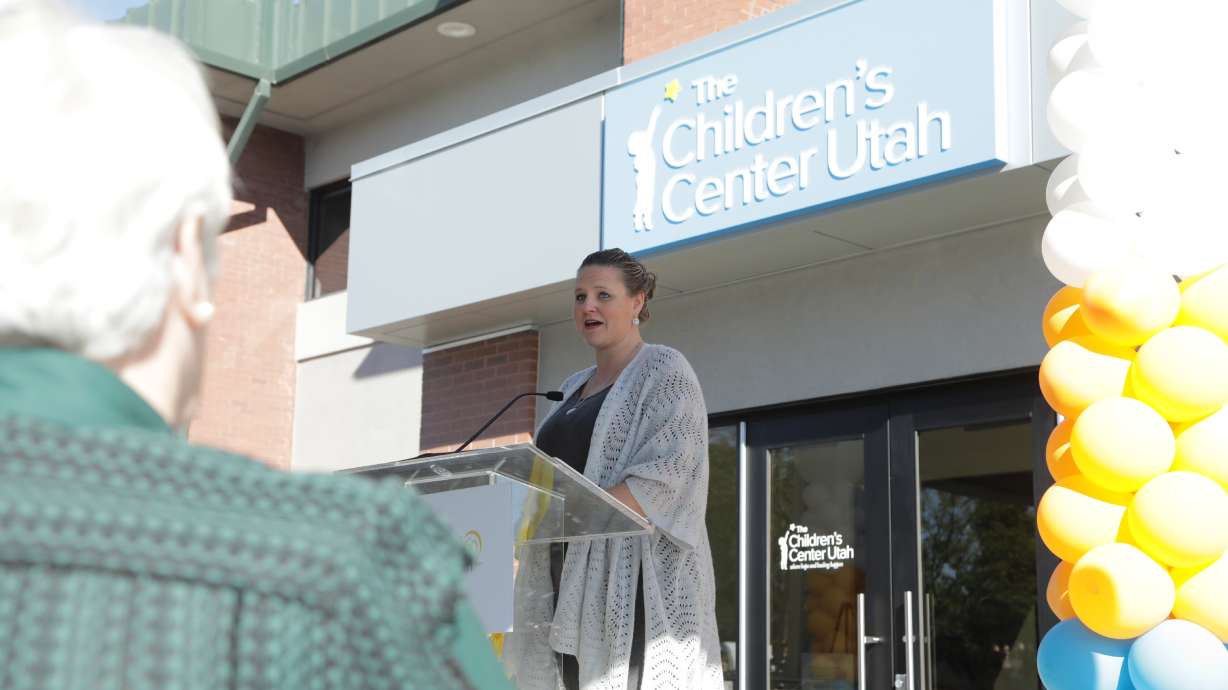 Cassie Bertot, family advisory board member at the Children's Center Utah, addressed the crowd at the new campus ribbon-cutting ceremony in West Valley City on Monday.