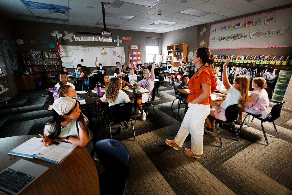 First-year teacher Margaret “Maggie” Johnston works with her students at Crescent Elementary in Sandy on Sept. 19.