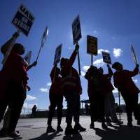 Biden urges striking auto workers to 'stick with it' in picket line visit unparalleled in history