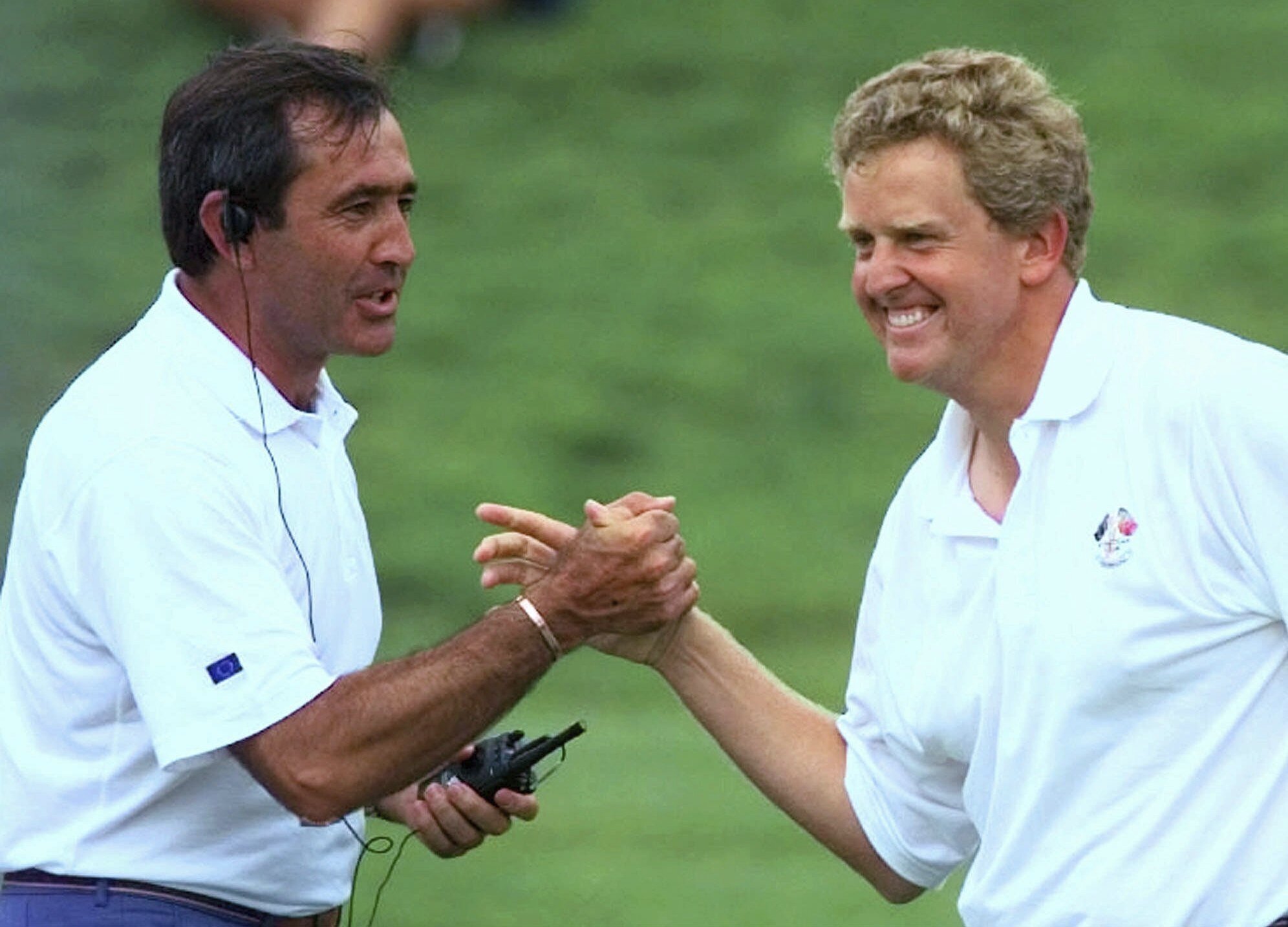 FILE - European Ryder Cup team captain Seve Ballesteros congratulates Scotland's Colin Montgomerie after he holed a putt on the 17th green to go one up in his fourball match on day two of the Ryder Cup at Valderrama golf coursein Valderrama, Spain, Saturday Sept. 27, 1997. Europe won in Spain to start three decades of never losing the Ryder Cup at home.