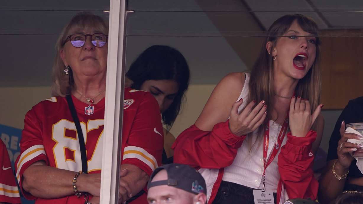 Taylor Swift, right, watches from a suite alongside Travis Kelce's mother, Donna Kelce, inside Arrowhead Stadium during an NFL football game between the Chicago Bears and Kansas City Chiefs Sunday, in Kansas City, Mo. Following the 12-time Grammy Award winner's appearance at the game, jersey sales for the All-Pro tight-end seemingly skyrocketed.