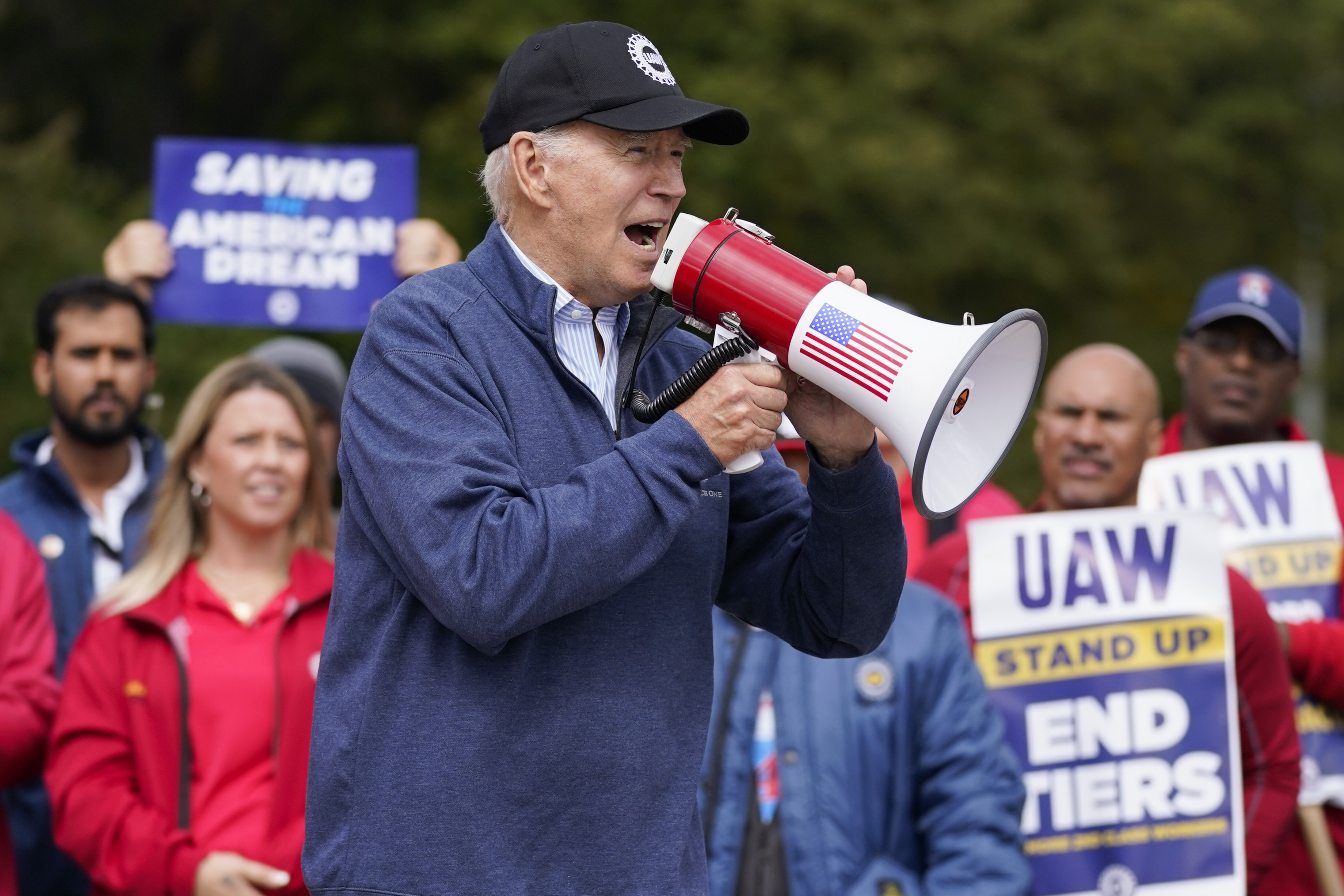 President Joe Biden joins striking United Auto Workers on the picket line, Tuesday in Van Buren Township, Mich.