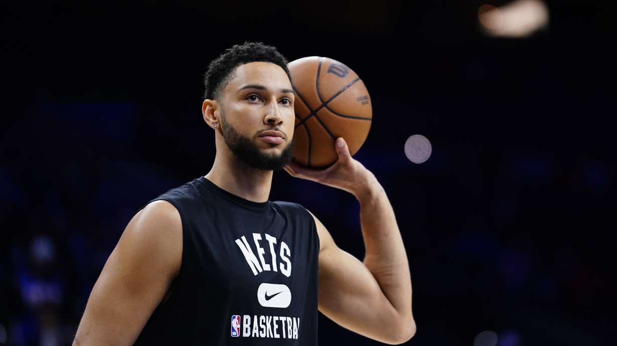FILE - Brooklyn Nets' Ben Simmons watches practice before an NBA basketball game, Thursday, March 10, 2022, in Philadelphia. Simmons is set to begin training camp next week with no restrictions after two injury-shortened seasons in Brooklyn. Nets coach Jacque Vaughn said Tuesday, Sept. 26, 2023, that the former All-Star has been playing 5-on-5 this summer and will have an expanded role offensively if he can avoid further injuries.