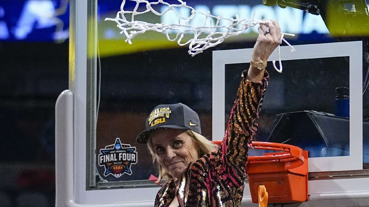 FILE - LSU head coach Kim Mulkey celebrates after cutting down the net after the NCAA Women's Final Four championship basketball game against Iowa, Sunday, April 2, 2023, in Dallas. Mulkey has agreed to a new 10-year contract worth about $32 million that will make her the highest-paid coach in women's college basketball, according to a person with knowledge of the deal.