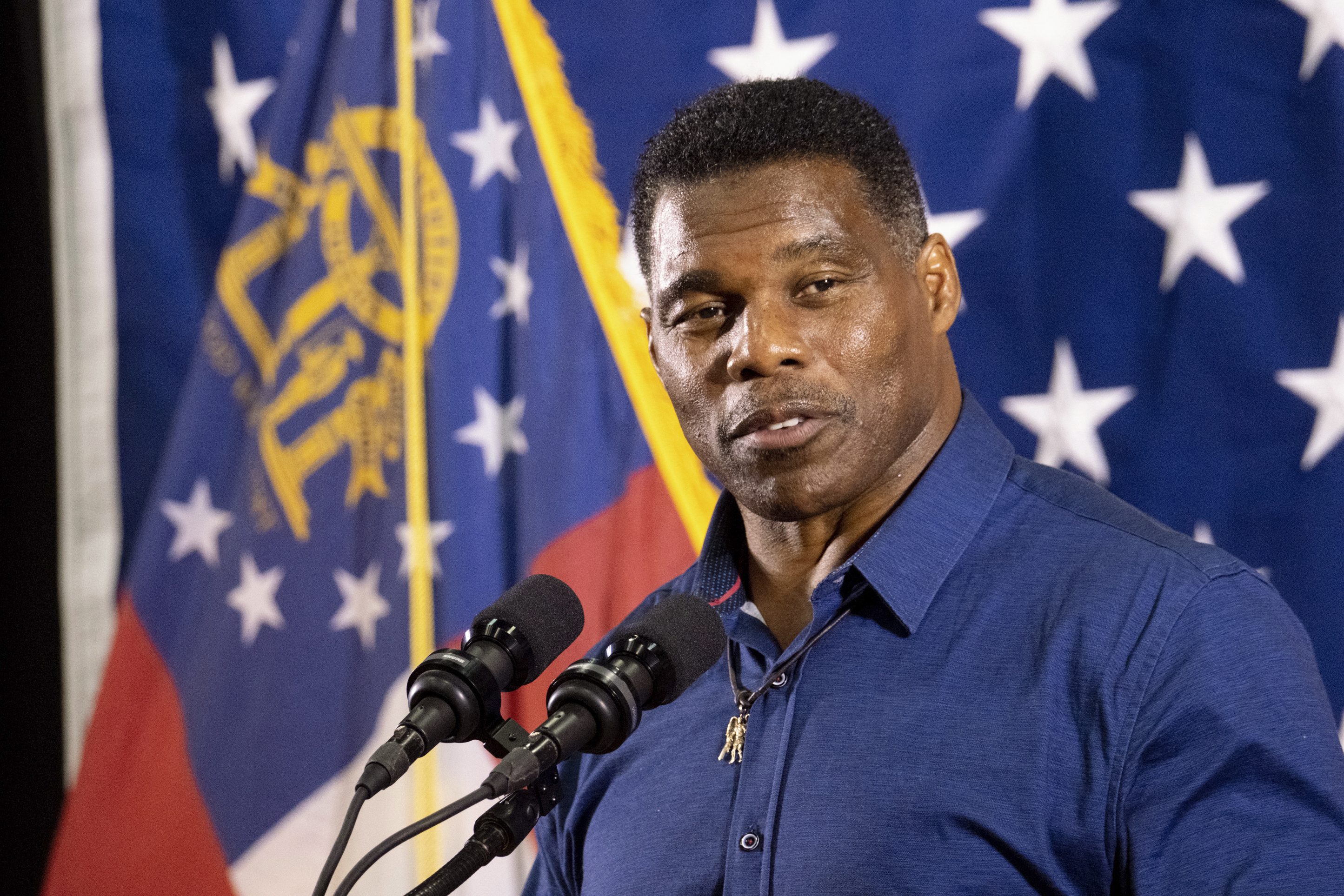 FILE - Republican candidate for U.S. Senate Herschel Walker speaks during a campaign stop at the Governors Gun Club, Dec. 5, 2022, in Kennesaw, Ga. Walker's wife is seeking to sell the Atlanta house that Walker listed as a residence during his Senate run.