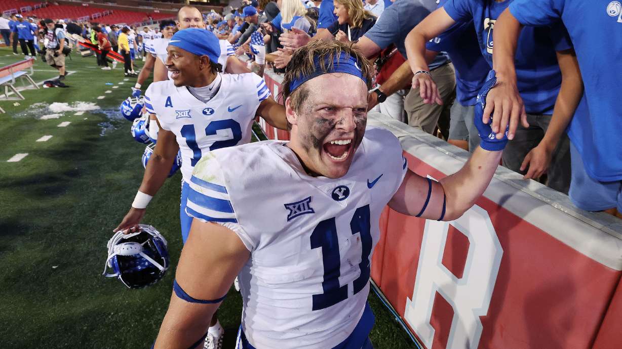 Brigham Young linebacker Harrison Taggart (11) celebrates the win over the Arkansas Razorbacks at Razorback Stadium in Fayetteville on Saturday, Sept. 16, 2023. BYU won 38-31.