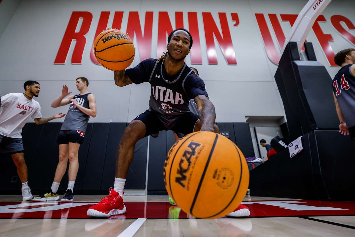 Utah Utes guard Deivon Smith dribbles two balls on the first official practice in Salt Lake City on Tuesday, September 26, 2023