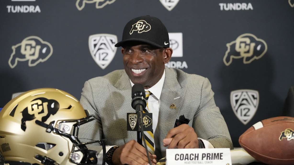 FILE - Deion Sanders speaks after being introduced as the new head football coach at the University of Colorado during a news conference Sunday, Dec. 4, 2022, in Boulder, Colo. Floyd Keith has waited half a century for a Black coach with Deion Sanders’ swagger and success to shake up college football.