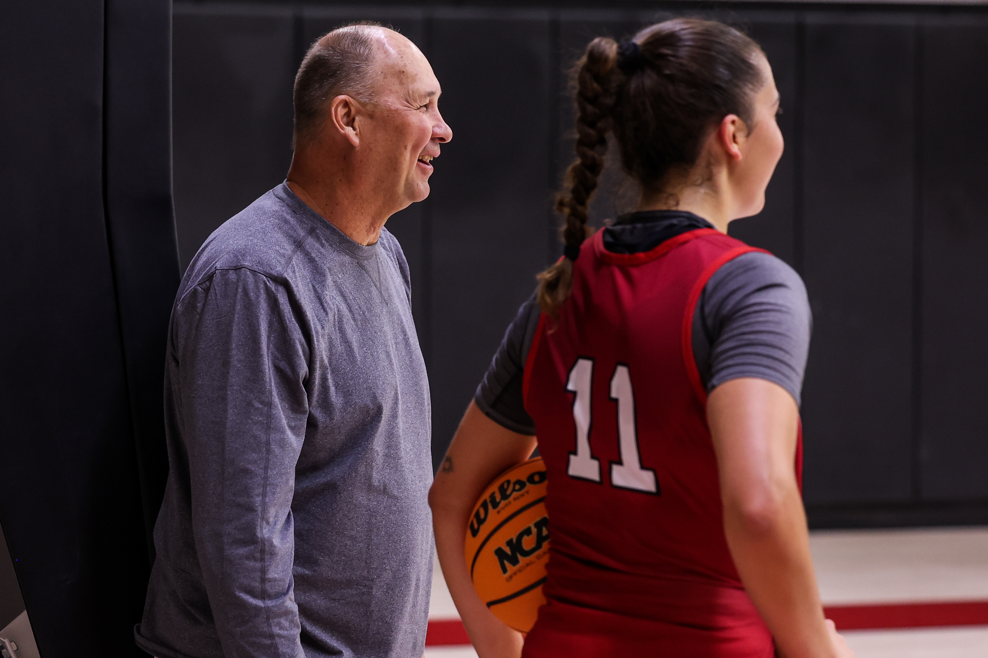 Assistant coach Jeff Judkins and Daniela Falcon Hernandez (11) talk during Utah's first official practice in Salt Lake City on Monday, Sept. 25, 2023.