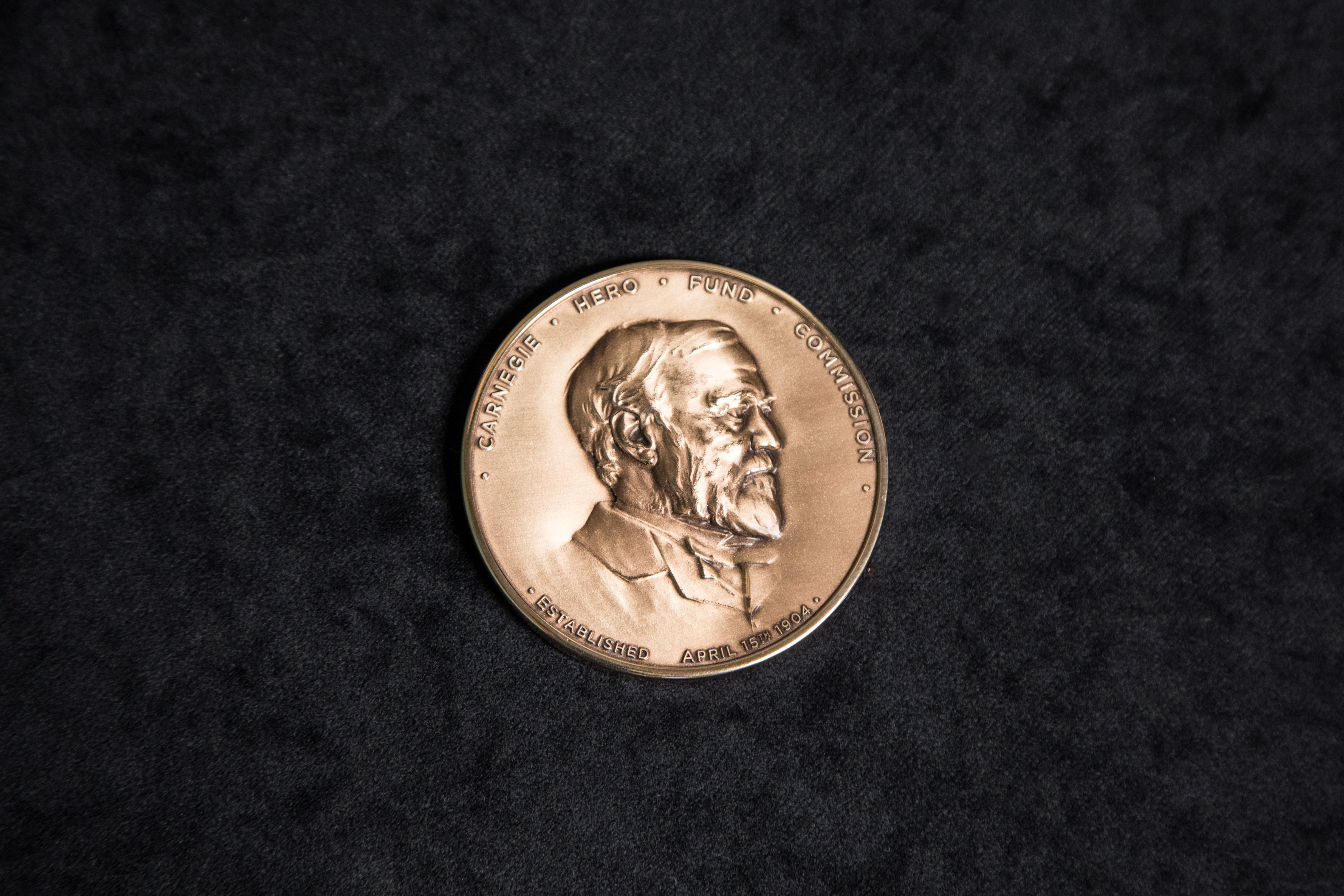 The front of the 2012-present Carnegie Medal.
