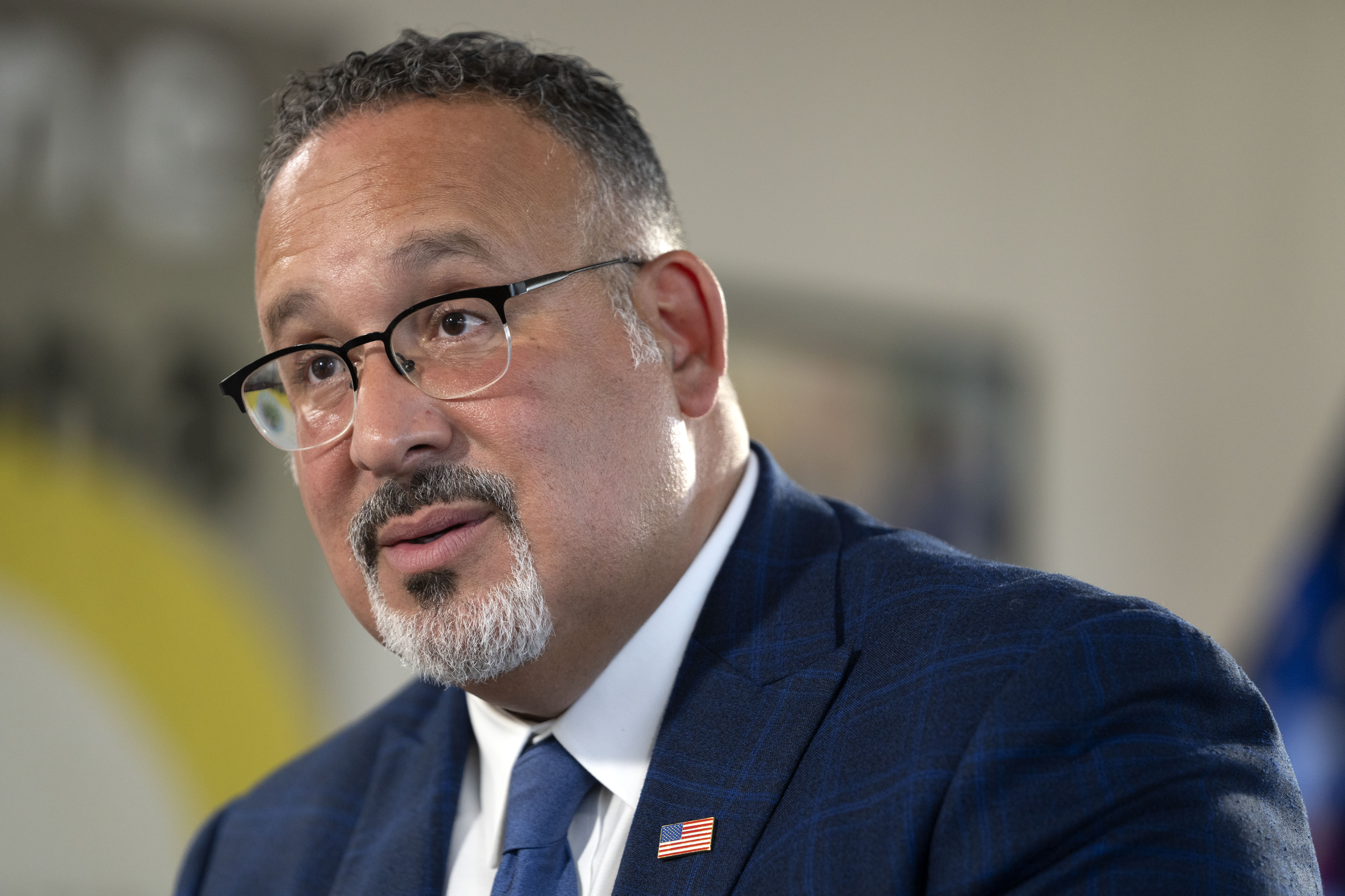 Education Secretary Miguel Cardona speaks during an interview with The Associated Press in his office at the Department of Education, Sept. 20 in Washington. A new federal rule threatens to cut federal money to college programs that consistently leave graduates with low pay or unaffordable debt.