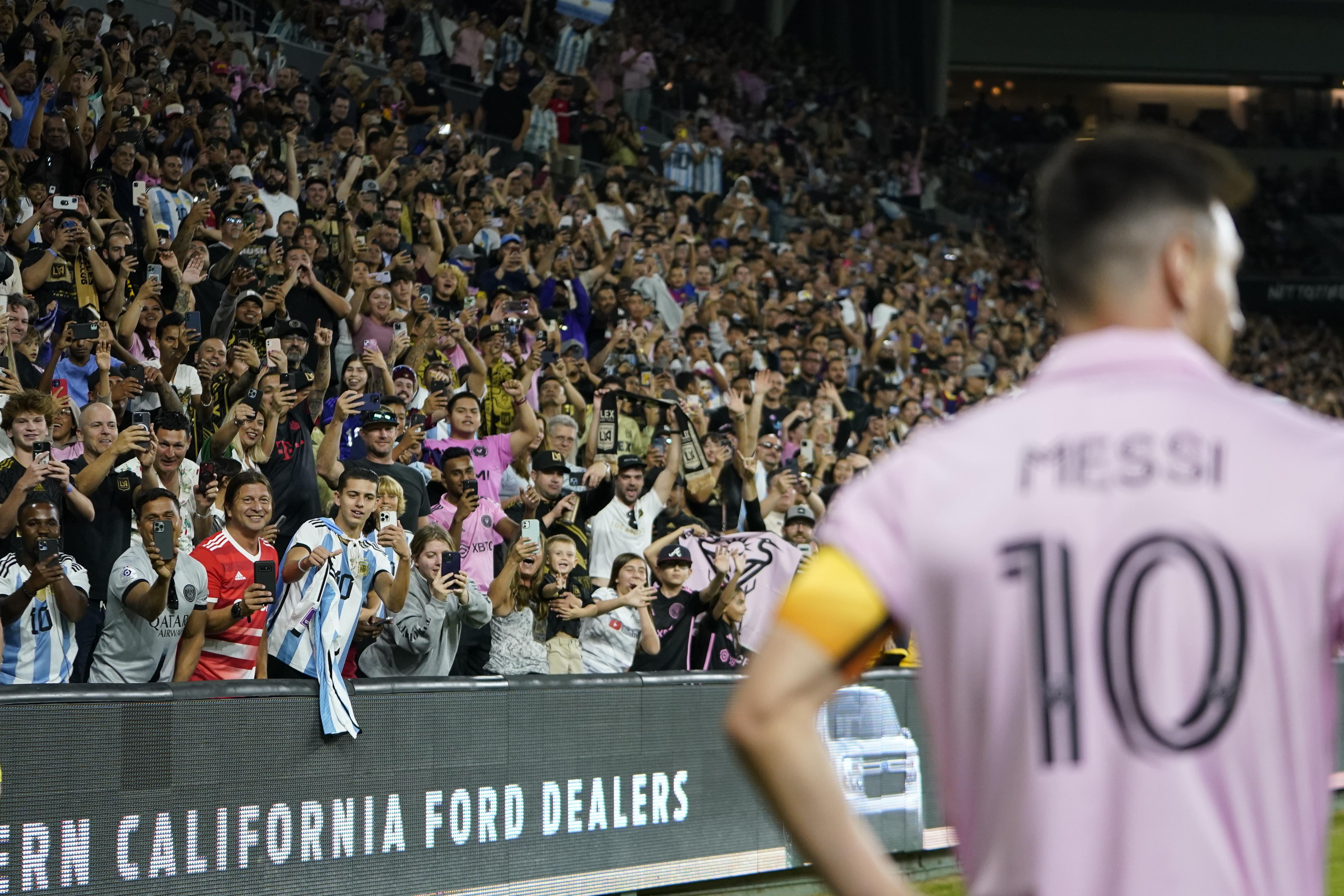 FILE - Fans cheer as Inter Miami forward Lionel Messi (10) waits for a corner kick during the second half of an MLS soccer match against Los Angeles FC, Sunday, Sept. 3, 2023, in Los Angeles. Messi, 36, has 11 goals and eight assists in 12 games across all competitions for Inter Miami.