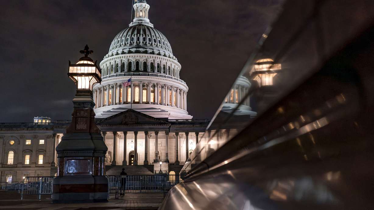 The Capitol is seen late Tuesday night in Washington, as lawmakers work to advance appropriations bills on the House floor. The Republican-controlled House and the Democrat-controlled Senate are starkly divided over very different paths to preventing a federal shutdown.