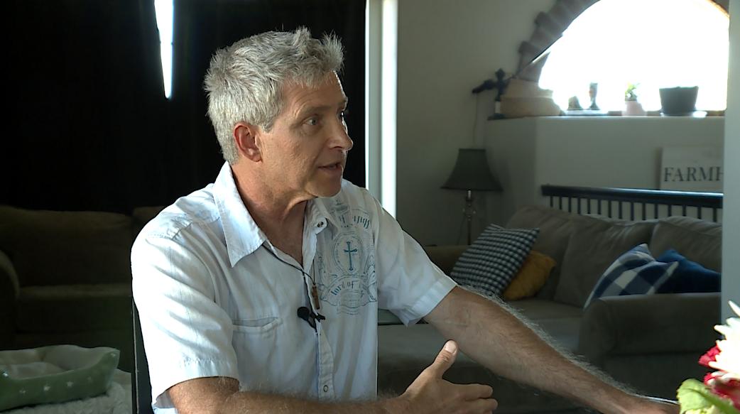 Rob Sivulka talks to KSL at his kitchen table Wednesday, the day after organizing public comment at the Jordan School District Board meeting.