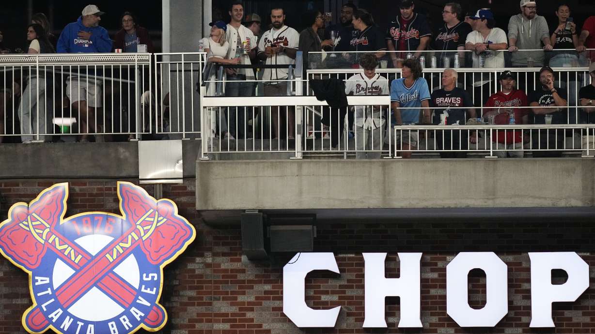 Fans watch a baseball game between Chicago Cubs and Atlanta Braves from the The Chop House above right field at Truist Park on Wednesday, Sept. 27, 2023, in Atlanta. Major League Baseball attendance is on track to increase about 9% and top 70 million for the first time since 2017, helped by a full offseason of sales, digital ticketing and increased social gathering spaces in stadiums.