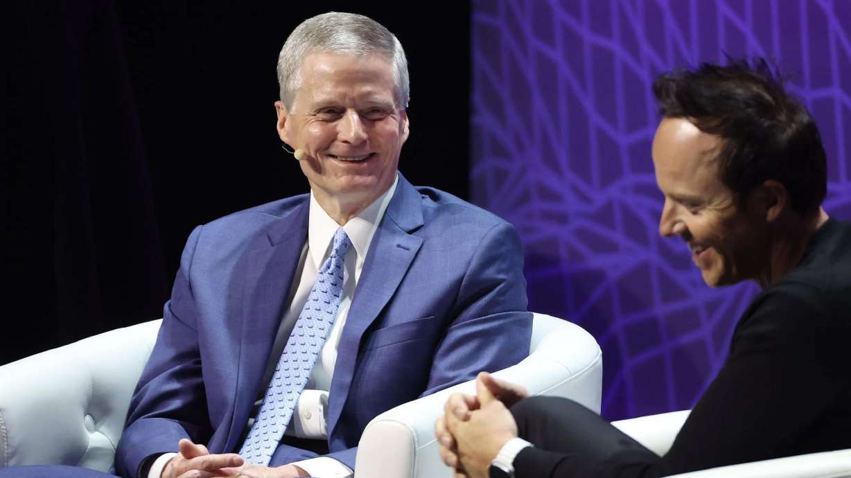 Elder David A. Bednar of the Quorum of the Twelve Apostles of The Church of Jesus Christ of Latter-day Saints talks with Utah Jazz owner Ryan Smith during Q&A session at Silicon Slopes 8th tech summit at the Delta Center in Salt Lake City on Thursday.