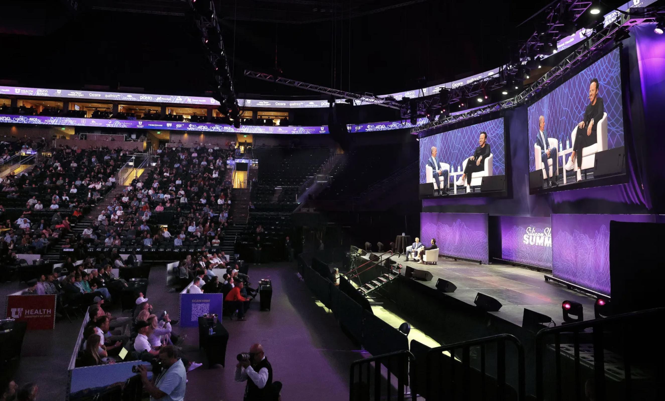 Elder David A. Bednar of Quorum of the Twelve Apostles of The Church of Jesus Christ of Latter-day Saints talks with Utah Jazz owner Ryan Smith during a Q&A session at the eighth annual Silicon Slopes Summit at the Delta Center in Salt Lake City on Thursday, Sept. 28, 2023.