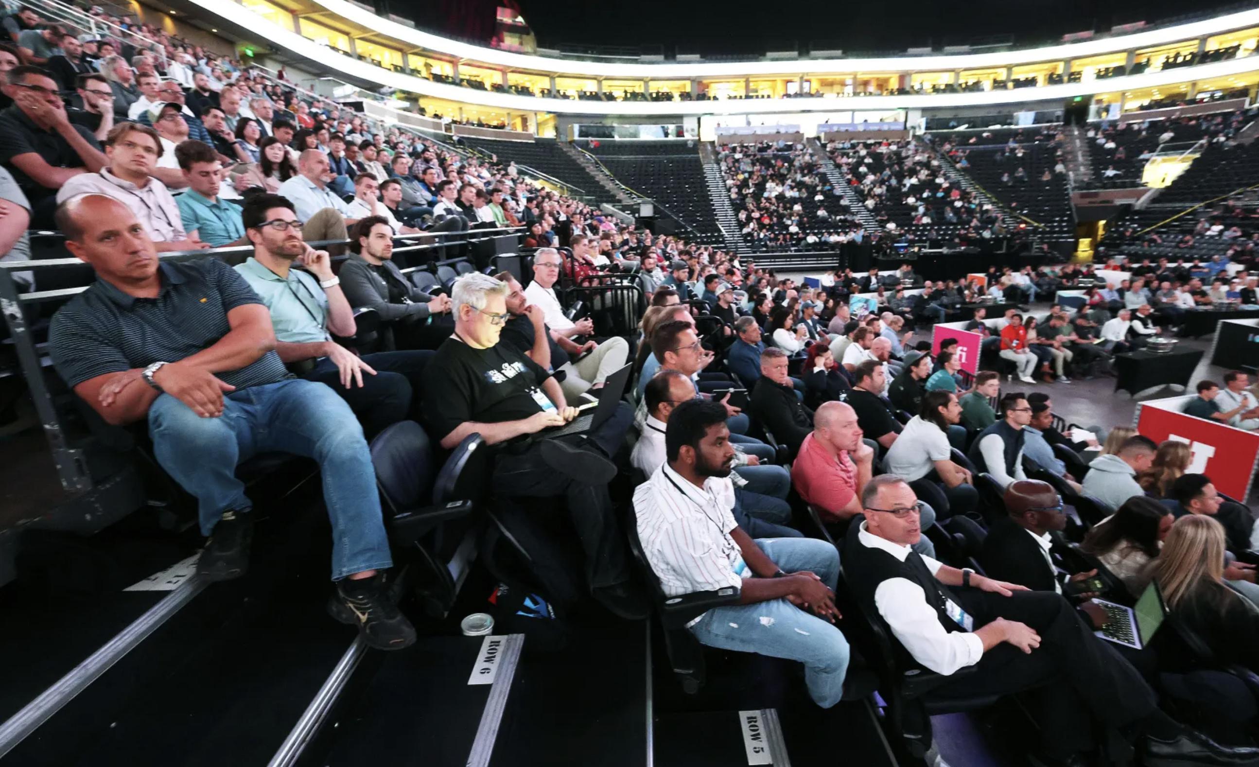 Attendees listen as Elder David A. Bednar of Quorum of the Twelve Apostles of The Church of Jesus Christ of Latter-day Saints talks with Utah Jazz owner Ryan Smith during a Q&A session at the eighth annual Silicon Slopes Summit at the Delta Center in Salt Lake City on Thursday.