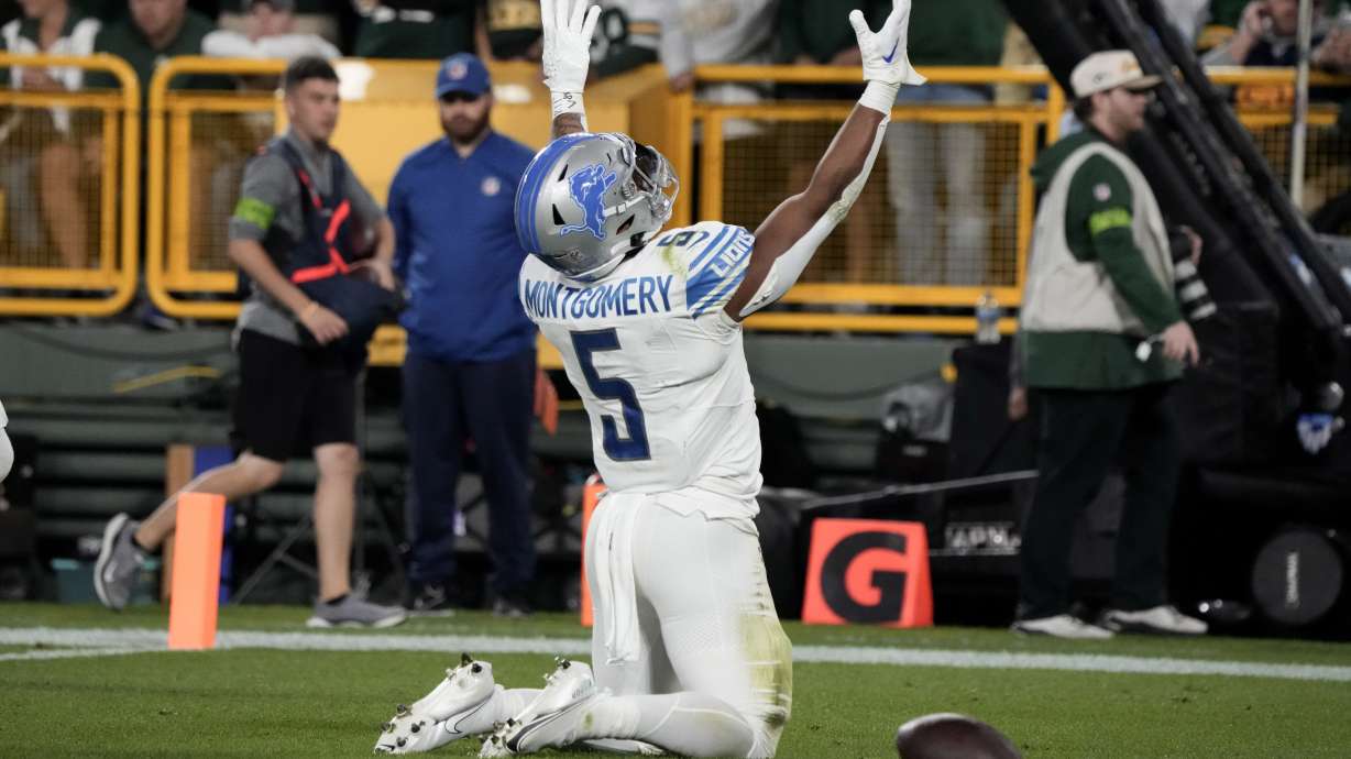 Detroit Lions running back David Montgomery (5) celebrates after a 2-yard touchdown run during the first half of an NFL football game against the Green Bay Packers, Thursday, Sept. 28, 2023, in Green Bay, Wis.