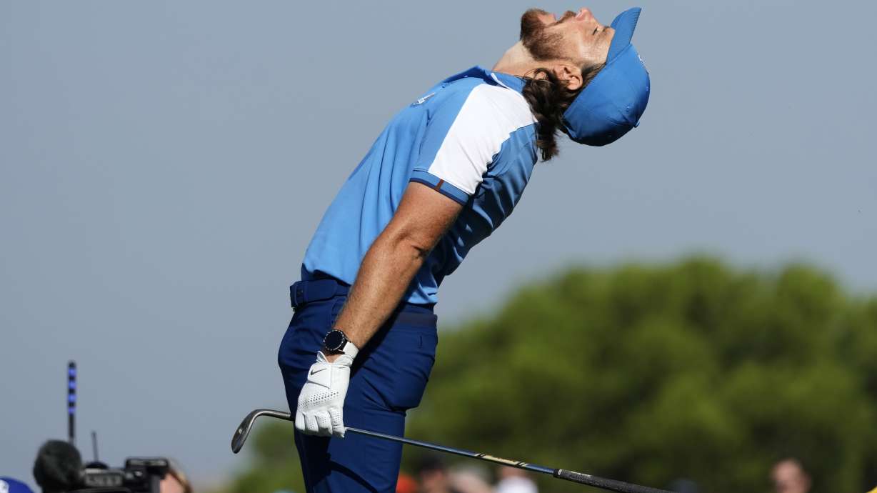 Europe's Tommy Fleetwood reacts after a chip onto the 10th green narrowly missed going holing out during his morning Foursome match at the Ryder Cup golf tournament at the Marco Simone Golf Club in Guidonia Montecelio, Italy, Friday, Sept. 29, 2023.