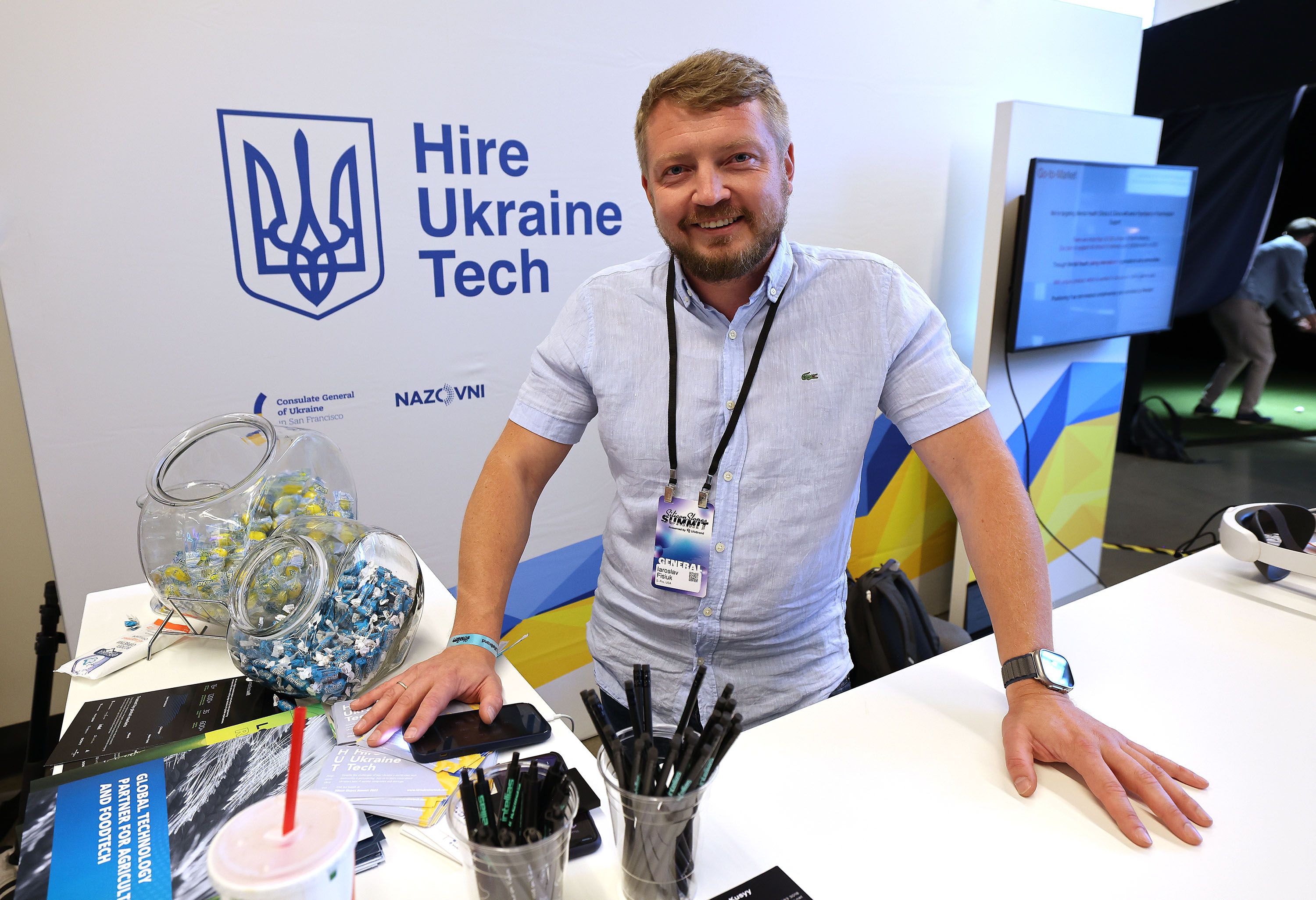 Yaroslav Fisiuk, a business development manager from Ukraine, waits to speak to attendees at the eighth annual Silicon Slopes Summit at the Delta Center in Salt Lake City on Thursday.