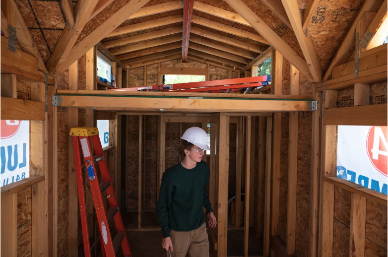 Aspen High School junior Max Sherman constructs a tiny home as part of a woodworking class Sept. 12, in Aspen, Colo. In John Fisher’s woodworking class, students learn skills to build a home.