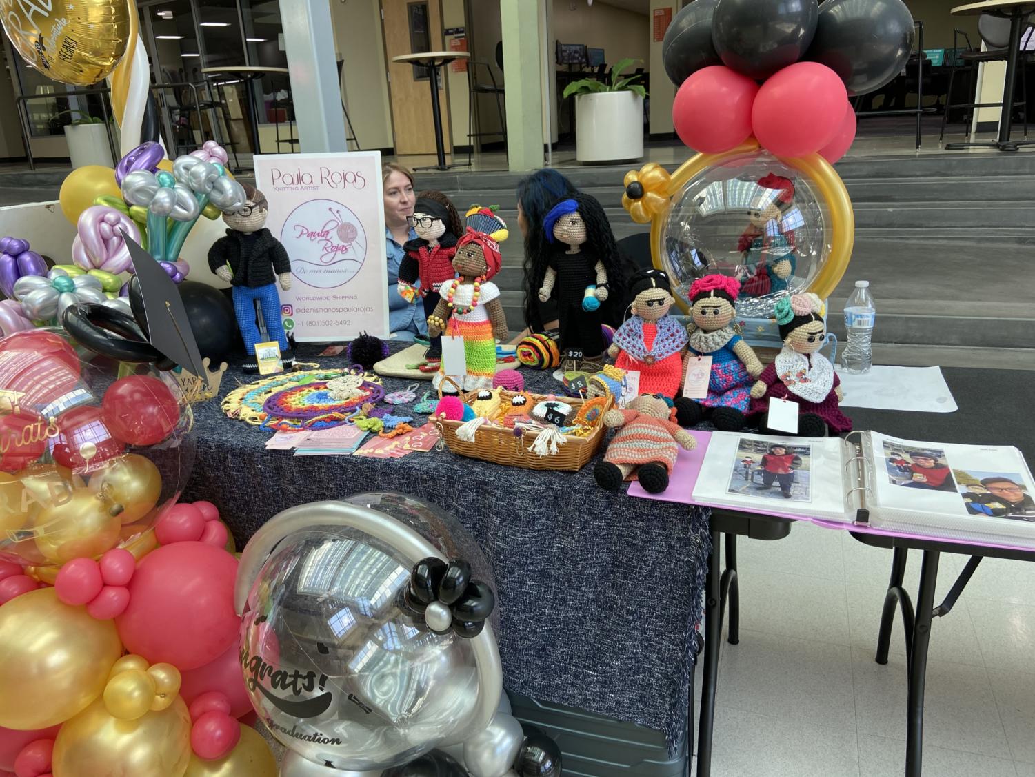 Artist Paula Rojas sells crocheted dolls and other items at Weber State University's El Mercadito during Hispanic Heritage Month in 2022.
