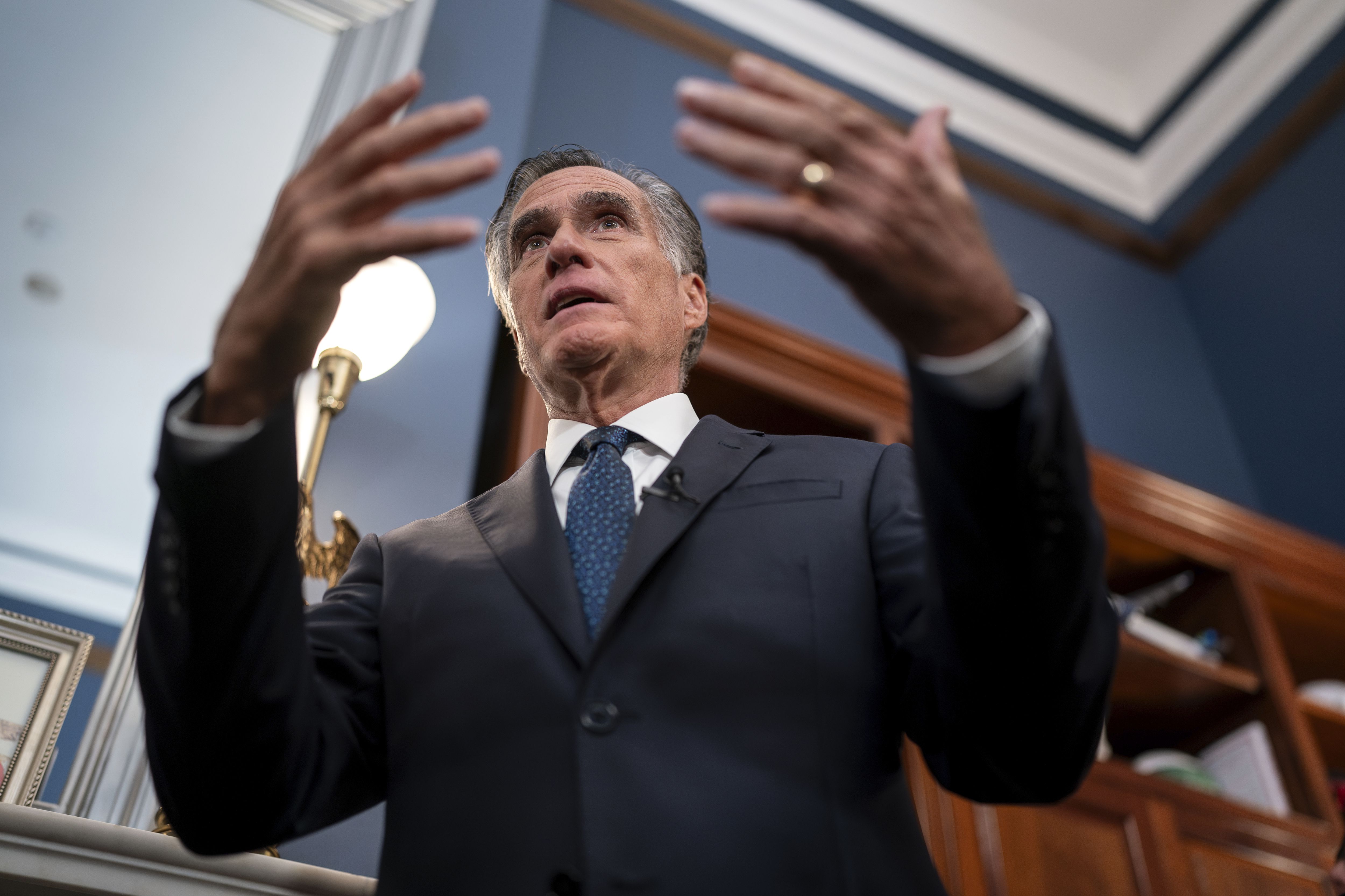 Utah Republican Sen. Mitt Romney speaks to reporters in his Capitol Hill office in Washington on Sept. 13, 2023. As Congress careens toward Saturday's shutdown deadline, Romney said he continues to try to find a way to keep the lights on.