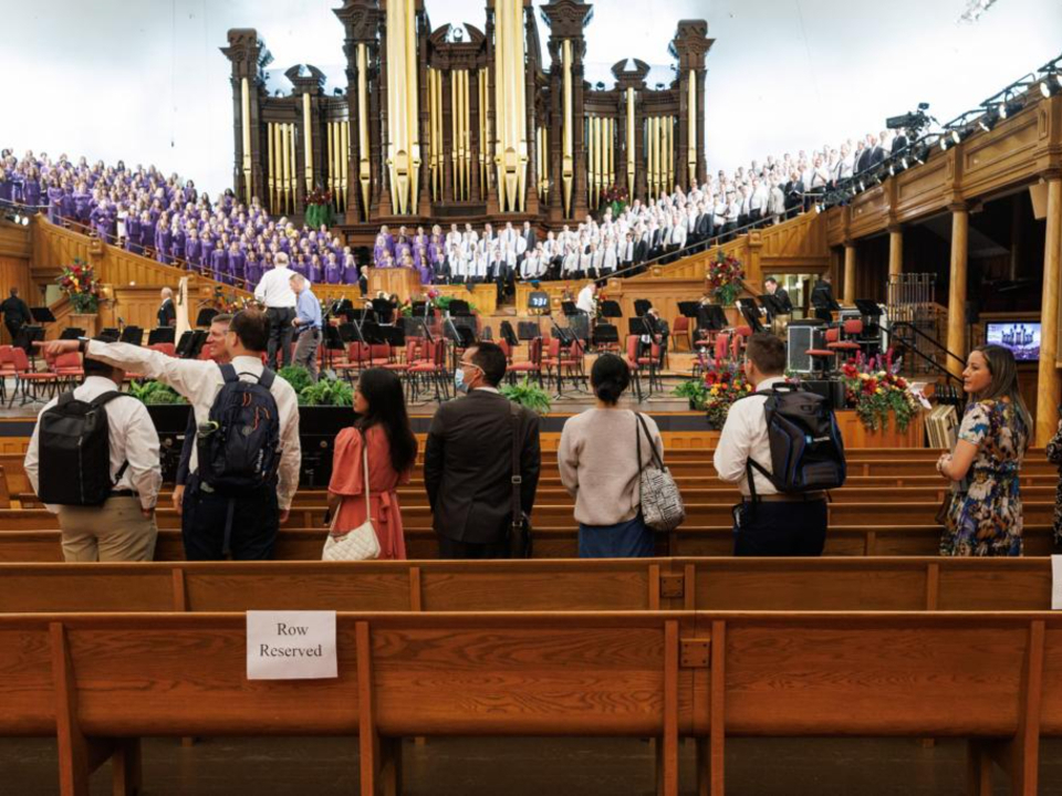 Some of the international church members who are joining the Tabernacle Choir at Temple Square for the October General Conference of The Church of Jesus Christ of Latter-day Saints watch the choir rehearse at the tabernacle in Salt Lake City.