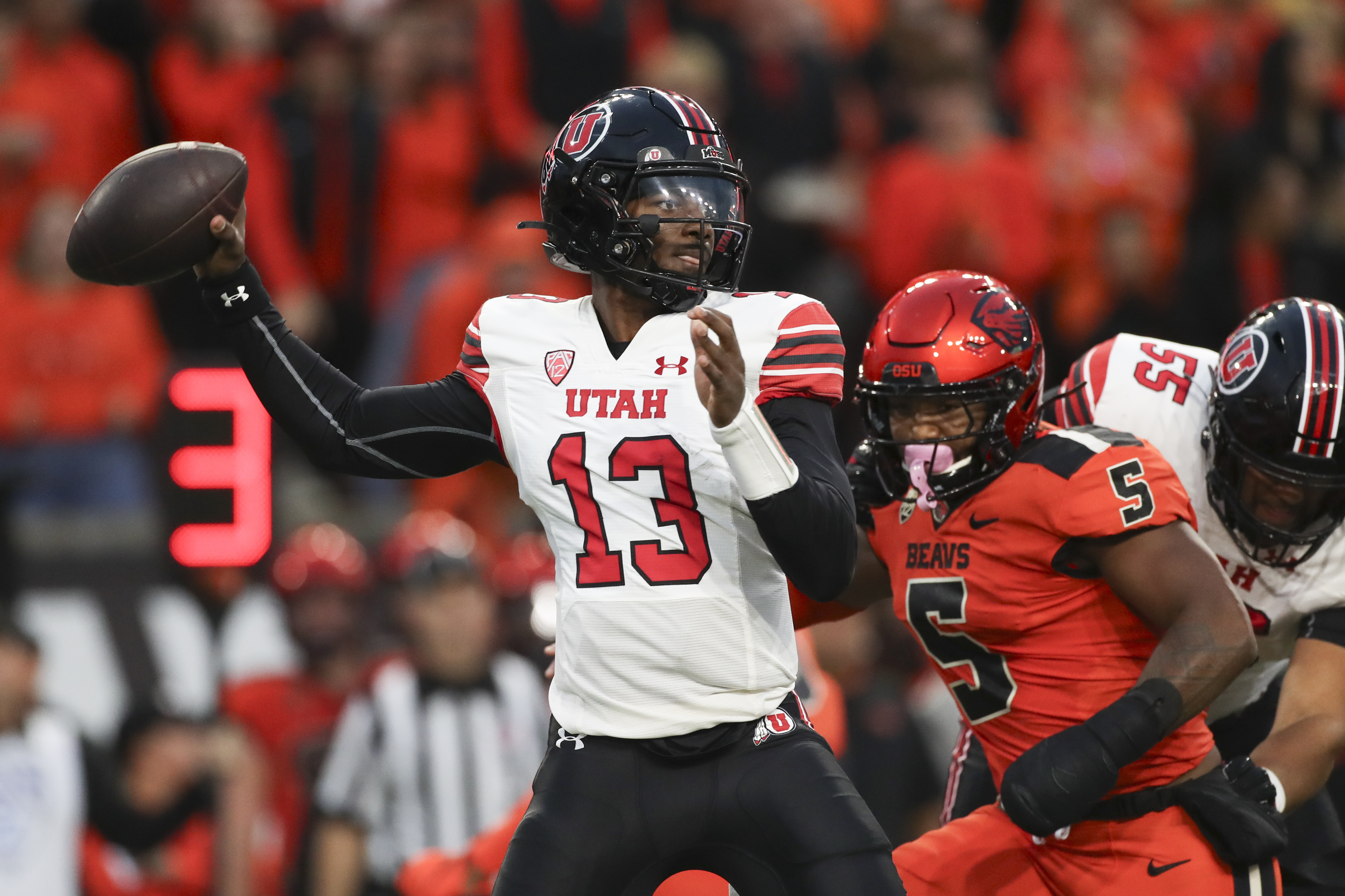 Utah quarterback Nate Johnson (13) drops back to pass against Oregon State during the first half of an NCAA college football game Friday, Sept. 29, 2023, in Corvallis, Ore.
