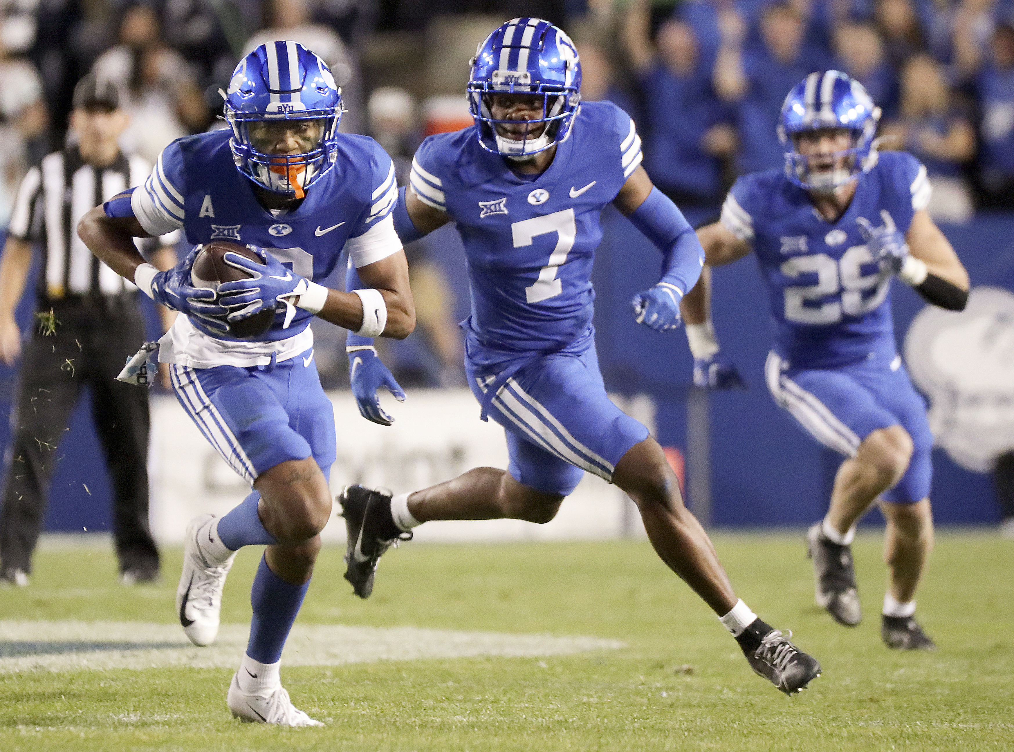 Brigham Young cornerback Jakob Robinson (0) intercepts a pass intended for the Cincinnati Bearcats and runs for a touchdown during the first half of a football game at LaVell Edwards Stadium in Provo on Friday, Sept. 29, 2023.
