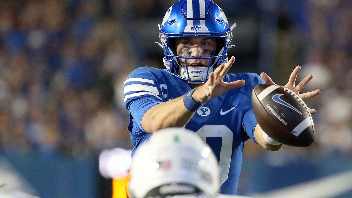 Brigham Young Cougars quarterback Kedon Slovis (10) catches a snap during a football game against the Cincinnati Bearcats at LaVell Edwards Stadium in Provo on Friday, Sept. 29, 2023. BYU won 35-27.