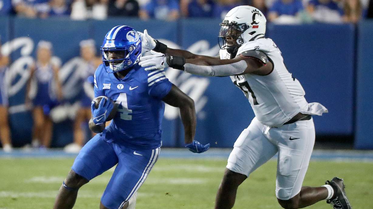 Brigham Young running back Miles Davis runs for yardage against the Cincinnati Bearcats during the second half of a football game at LaVell Edwards Stadium in Provo on Friday, Sept. 29, 2023. BYU won 35-27.