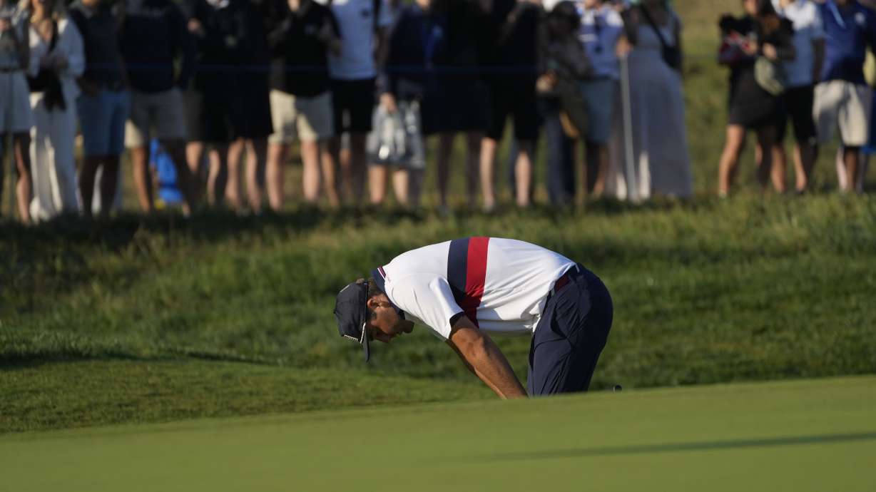 United States' Scottie Scheffler reacts after a poor shot on the 3rd green during their morning Foursomes match at the Ryder Cup golf tournament at the Marco Simone Golf Club in Guidonia Montecelio, Italy, Saturday, Sept. 30, 2023.