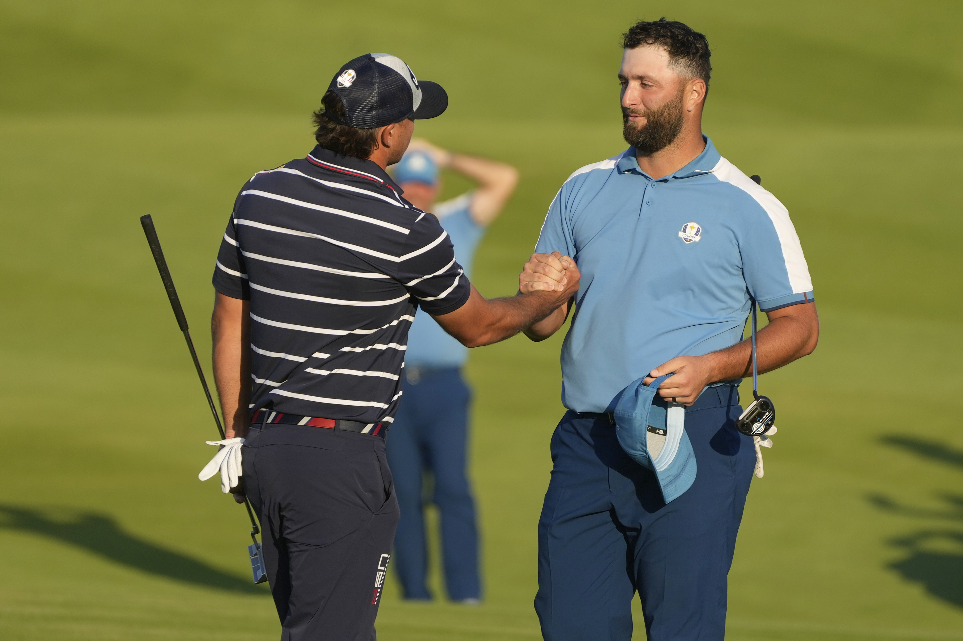 Europe's Jon Rahm shakes hands with United States' Brooks Koepka after the match was tied in their afternoon Fourballs match at the Ryder Cup golf tournament at the Marco Simone Golf Club in Guidonia Montecelio, Italy, Friday, Sept. 29, 2023.
