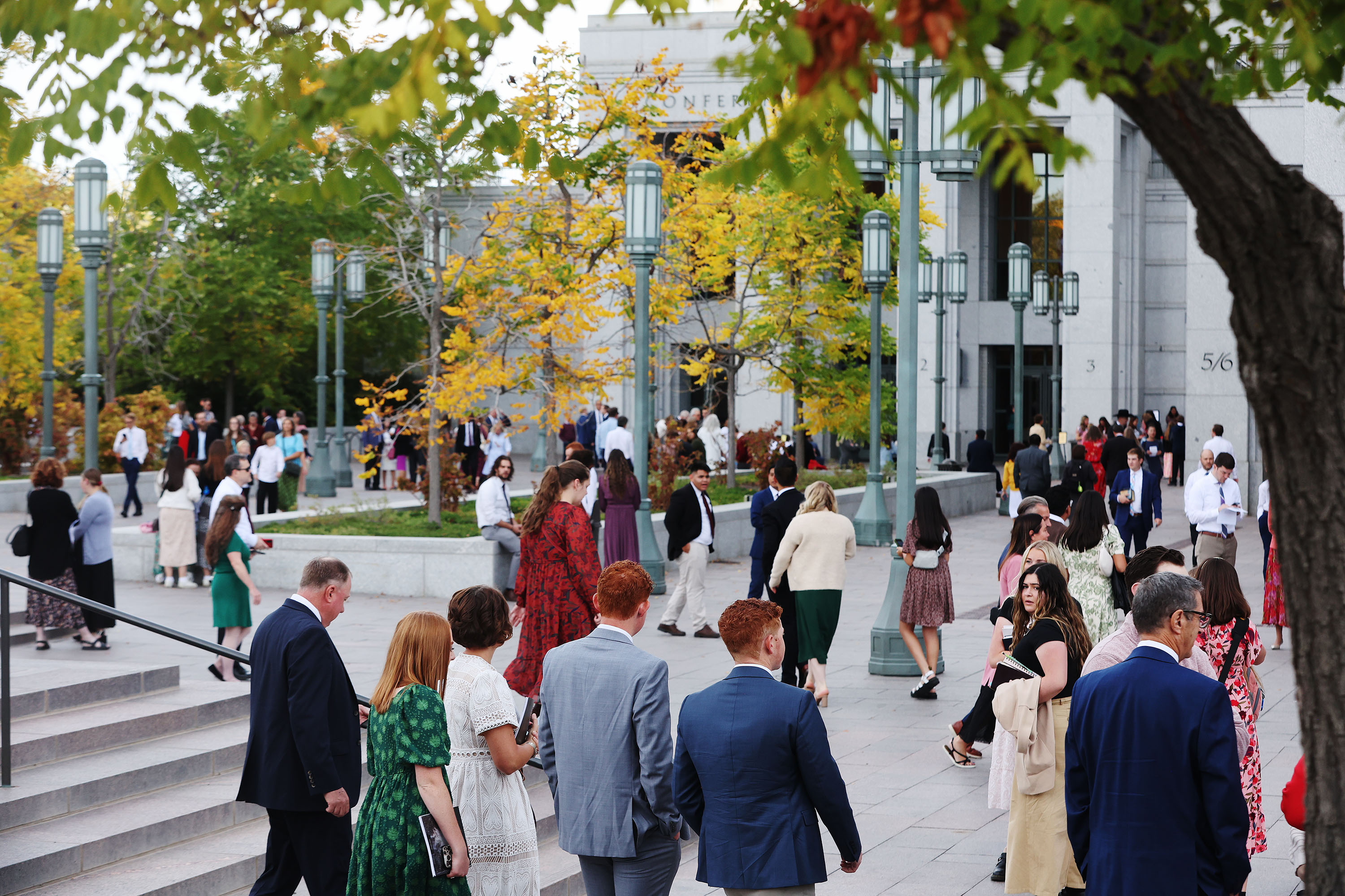 Attendees walk to the 193rd Semiannual General Conference of The Church of Jesus Christ of Latter-day Saints at the Conference Center in Salt Lake City on Saturday.