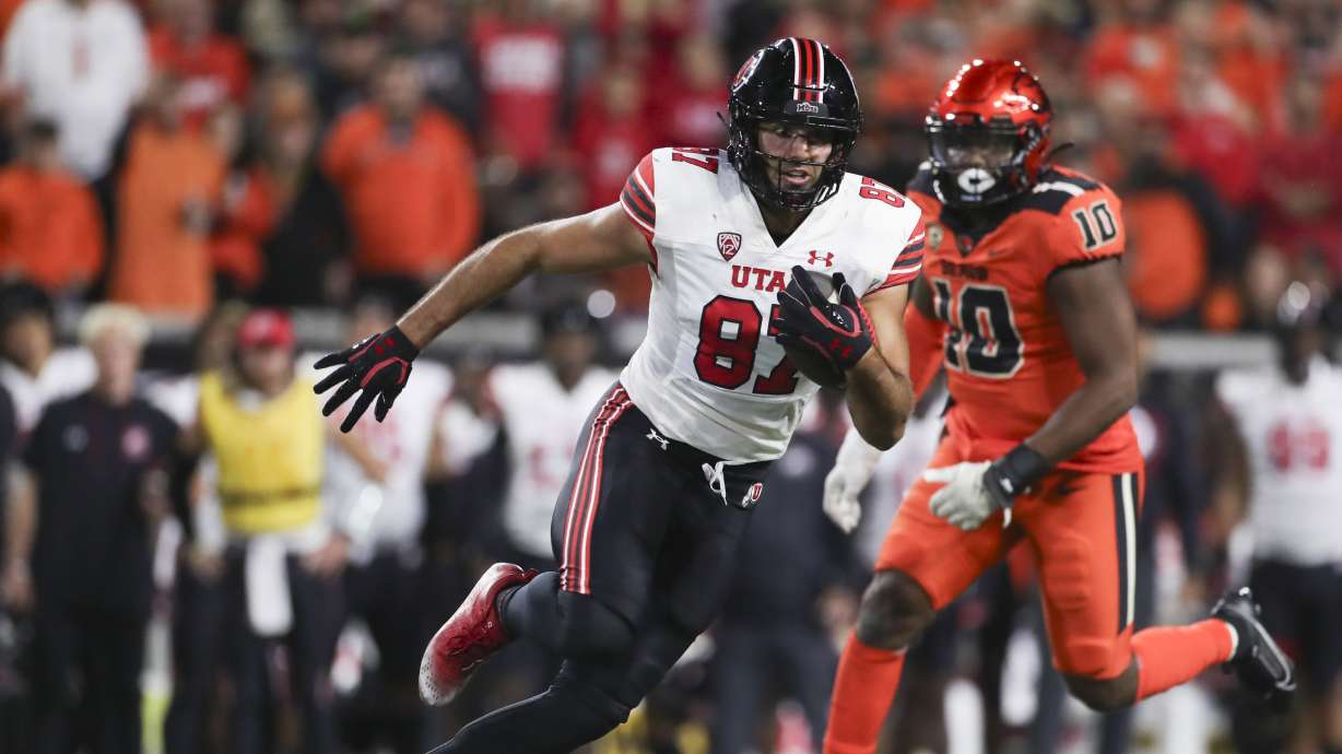 Utah tight end Thomas Yassmin (87) runs past Oregon State linebacker Andrew Chatfield Jr. (10) during the second half of an NCAA college football game Friday, Sept. 29, 2023, in Corvallis, Ore. Oregon State won 21-7.