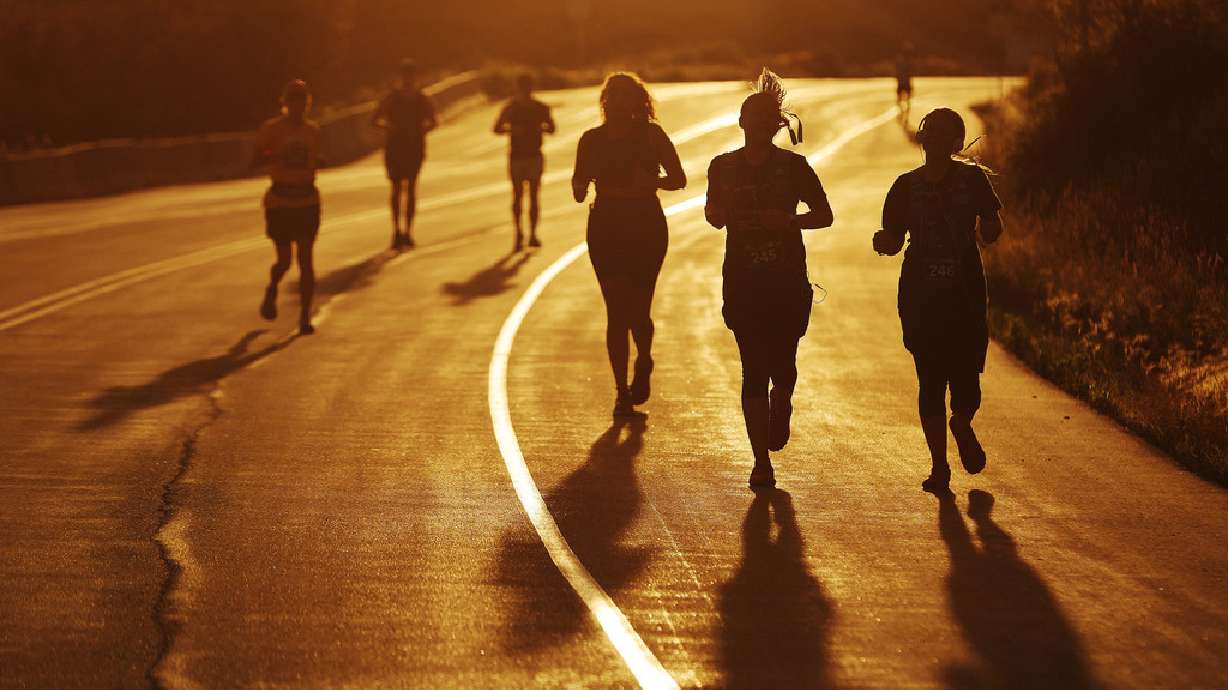 Runners compete as the sun rises during the Deseret News Marathon in Emigration Canyon on July 24. A new study looks at what exercises are a good way to improve heart health.