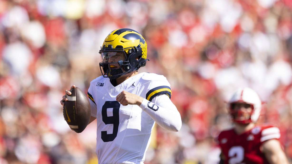 Michigan quarterback J.J. McCarthy (9) runs in a touchdown against Nebraska during the first half of an NCAA college football game Saturday, Sept. 30, 2023, in Lincoln, Neb.