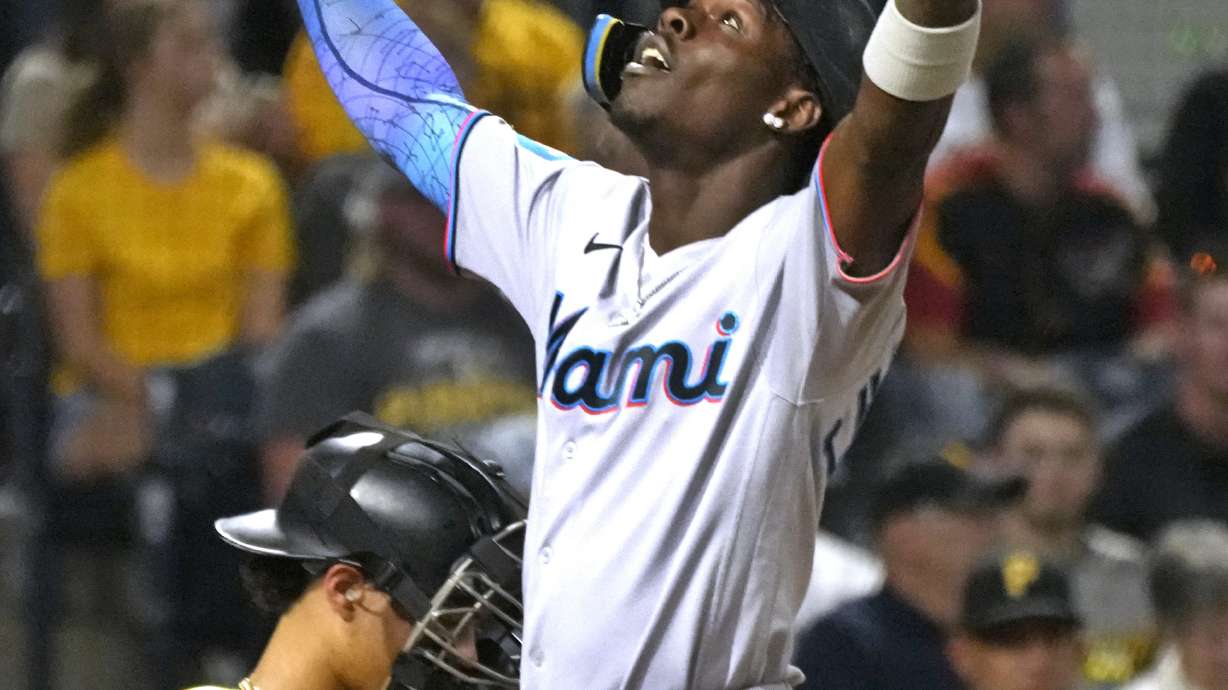 Miami Marlins' Jazz Chisholm Jr., right, celebrates as he returns to the dugout after hitting a solo home run off Pittsburgh Pirates starting pitcher Quinn Priester during the third inning of a baseball game in Pittsburgh, Saturday, Sept. 30, 2023.